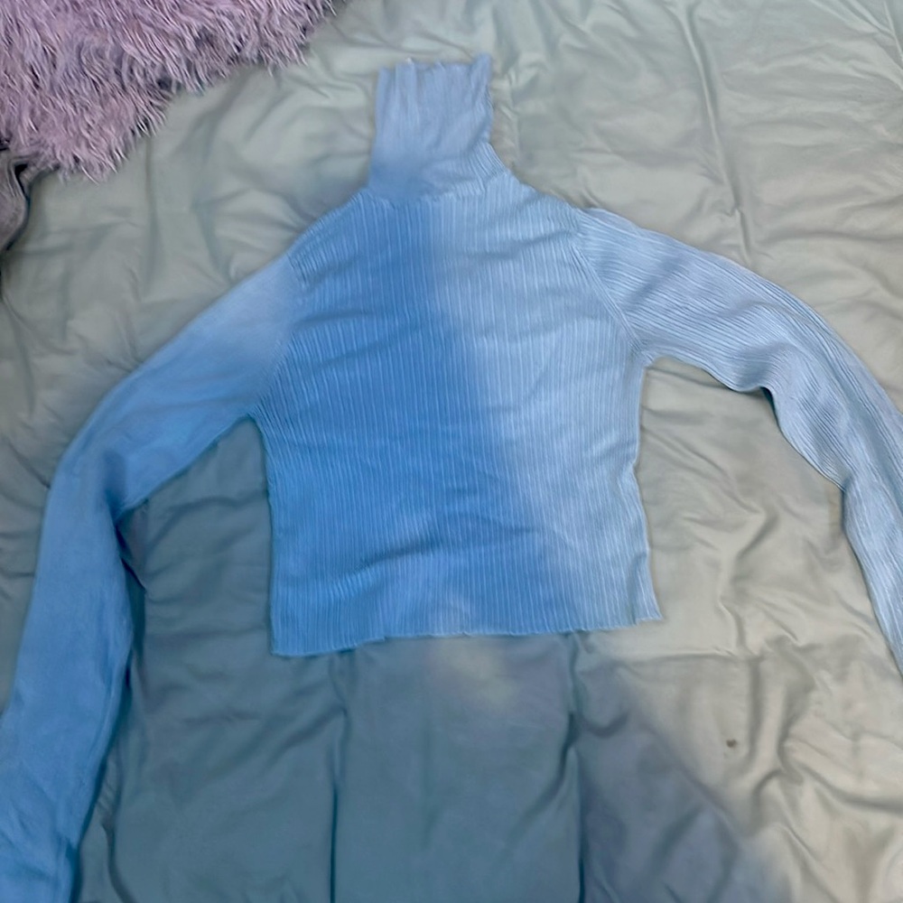 light blue turtle neck, pretty tight fit